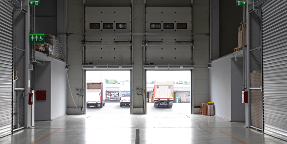 inside industrial unit warehouse large garage doors